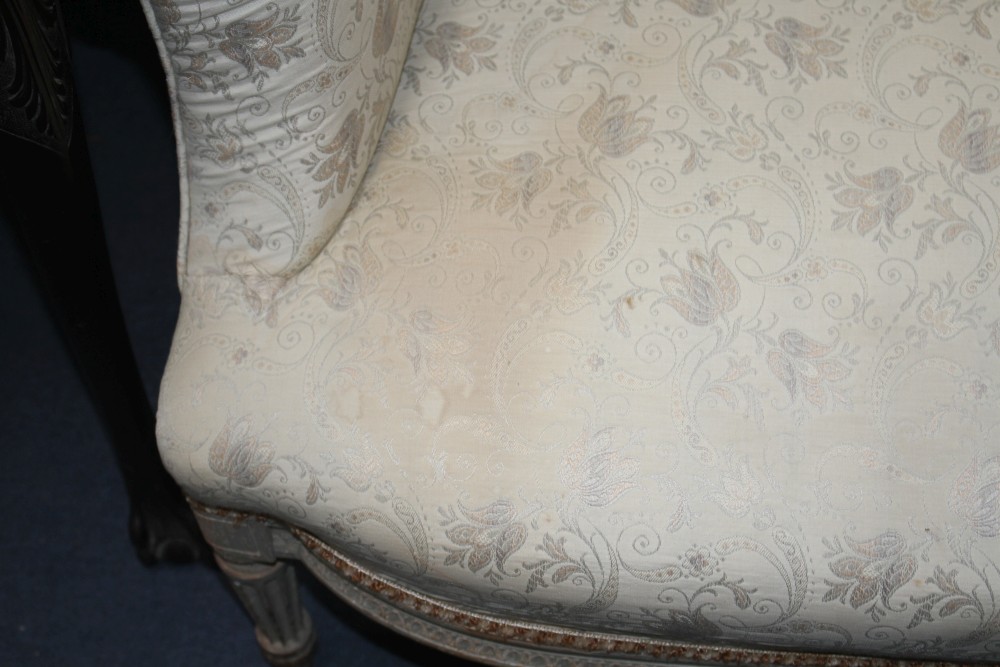 A Louis XVI wing armchair with painted beech underframe, W.75cm D.80cm H.102cm